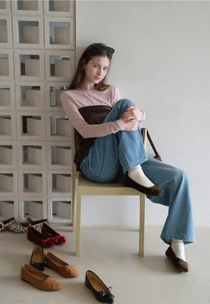 Long sleeve top with ruffled hem and layered design