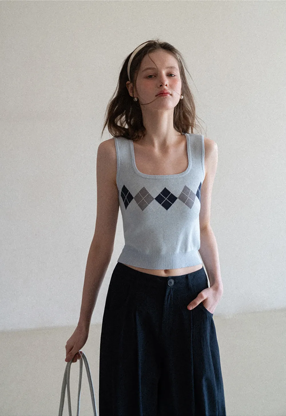 Woolen knit sweater with argyle pattern and buttons