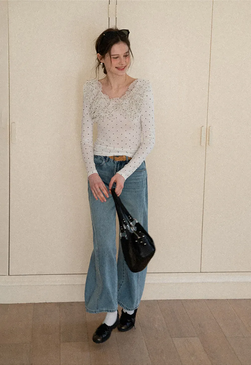 Polka dot long sleeve top with ruffled neckline