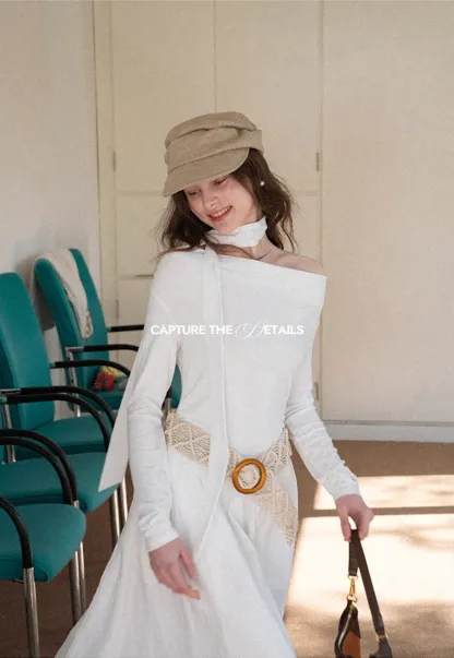 Elegant asymmetrical long sleeve dress with unique belt design