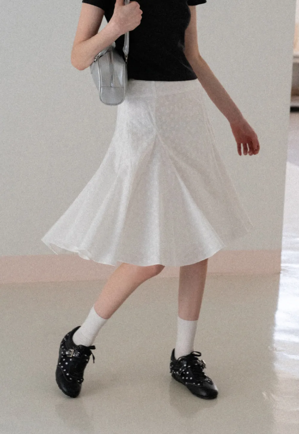 Flared pleated skirt with subtle texture