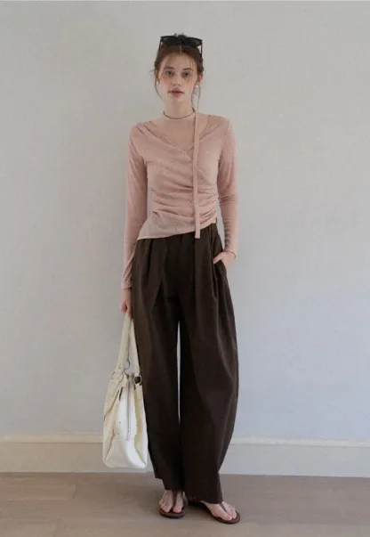 Asymmetrical rap-front draped knit top