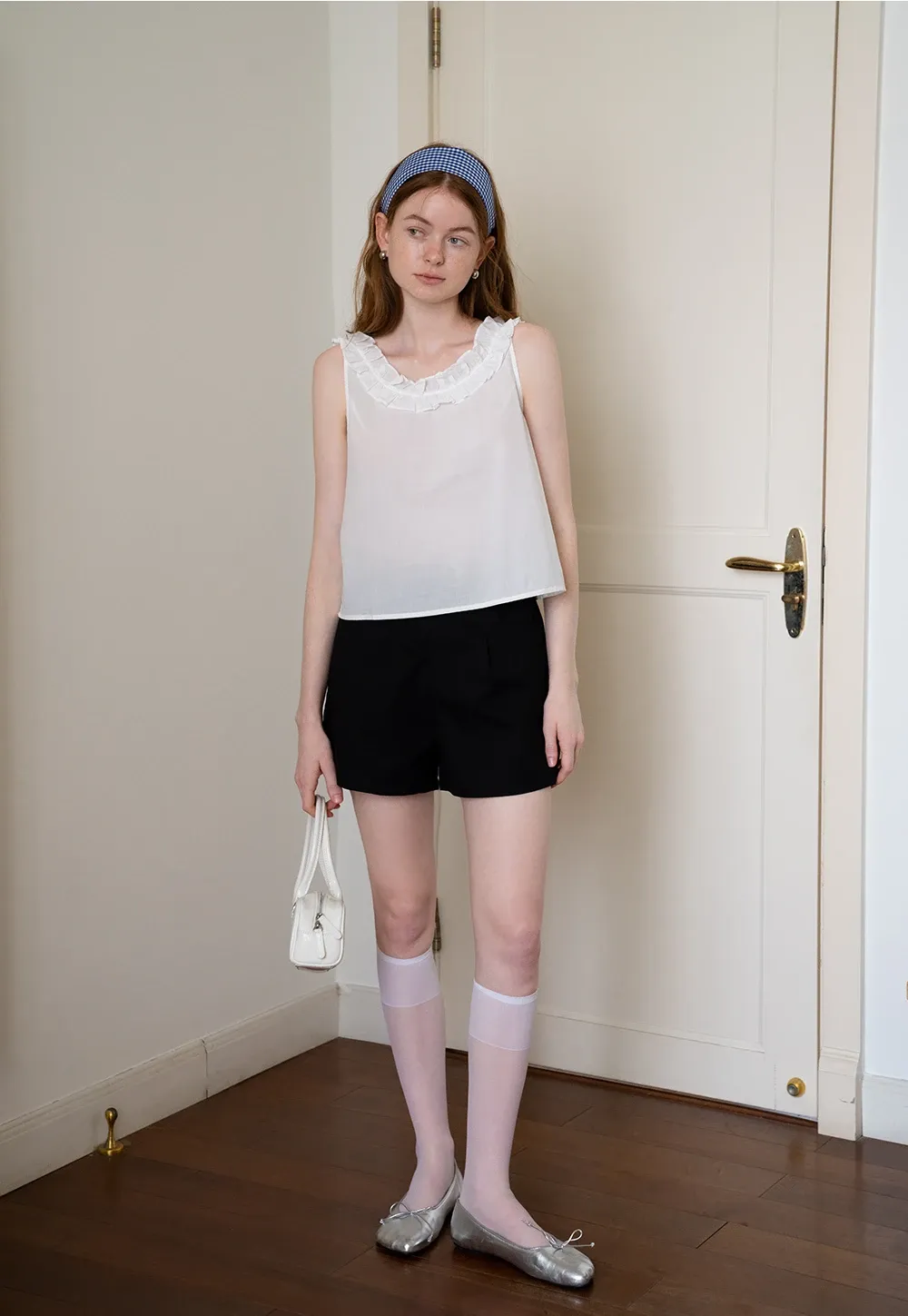 Women’s Sleeveless Top with Ruffle Neckline