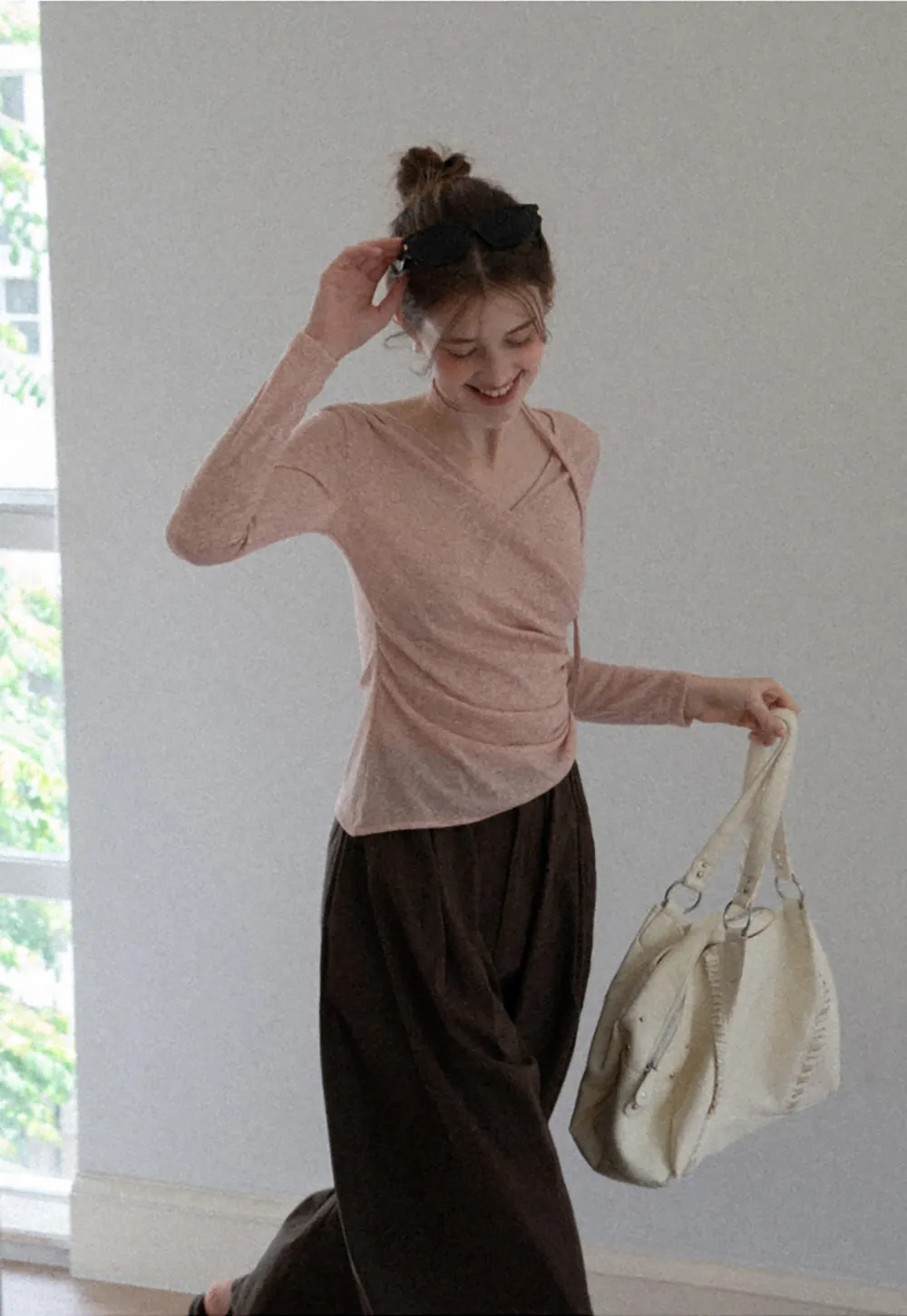 Asymmetrical rap-front draped knit top