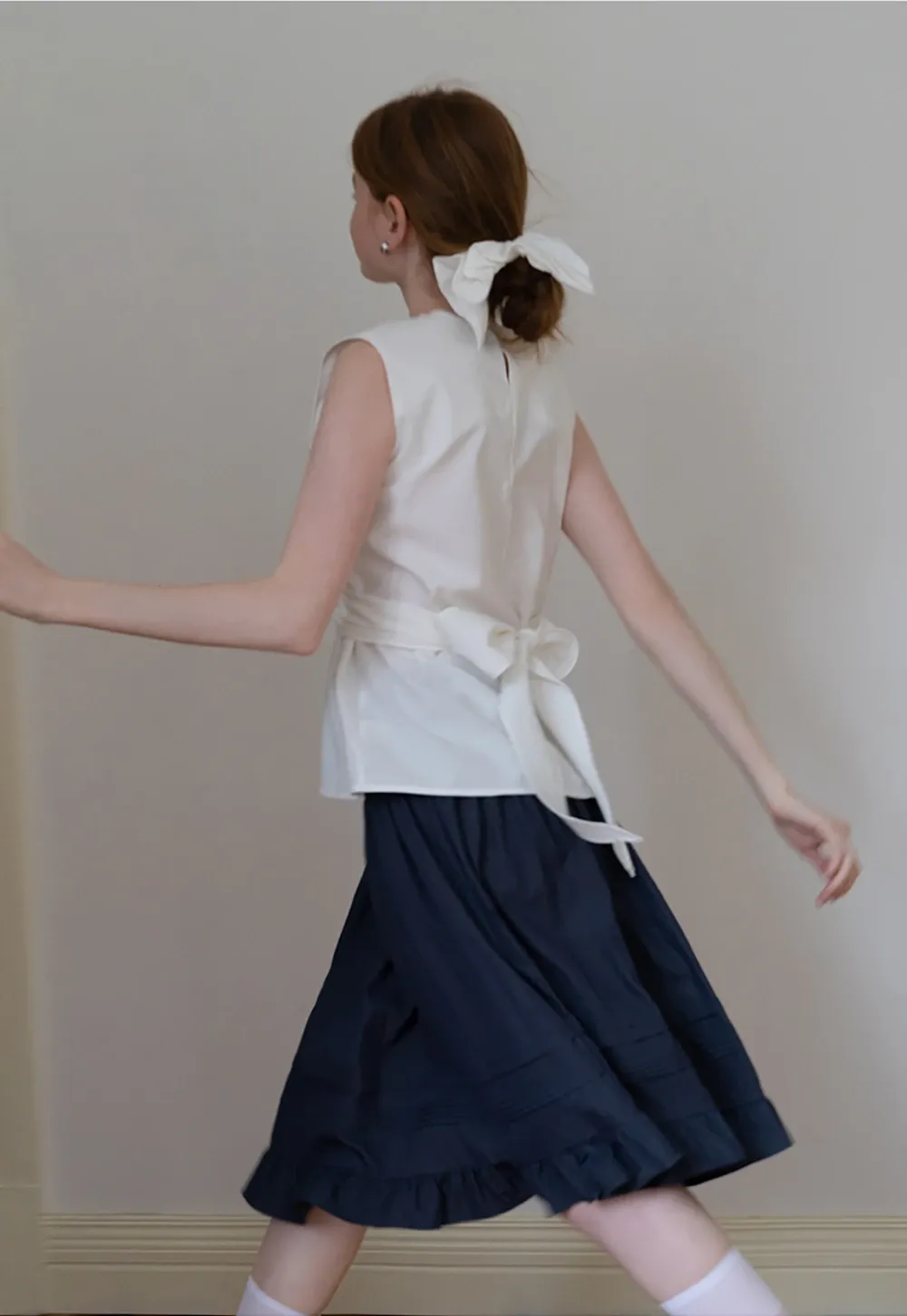 Women’s Twist-Front Sleeveless Peplum Top