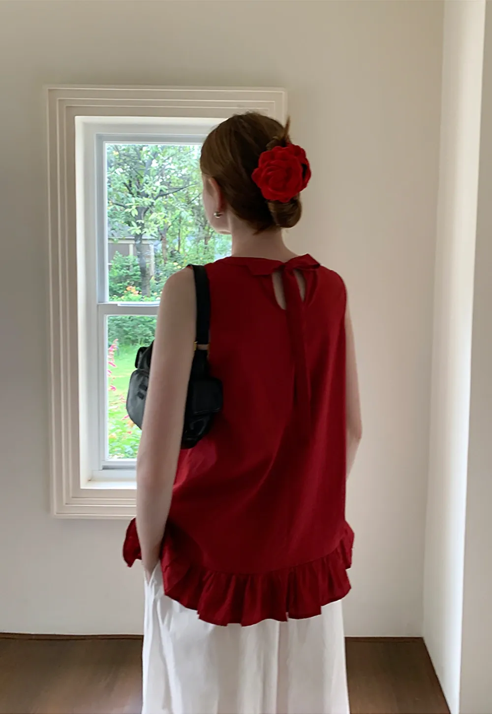 Women’s Sleeveless Ruffle Hem Top with Back Bow Tie
