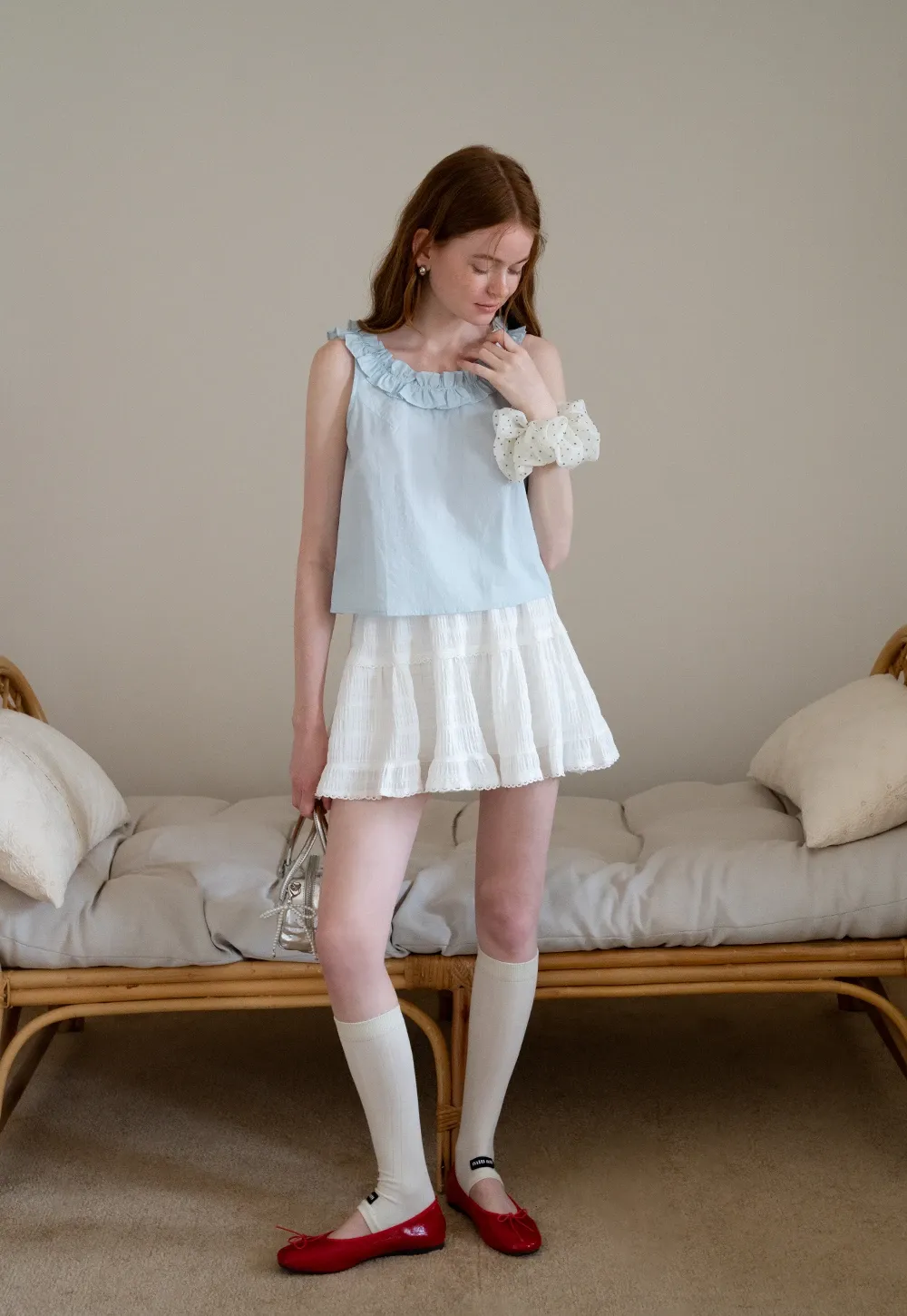 Women’s Sleeveless Top with Ruffle Neckline