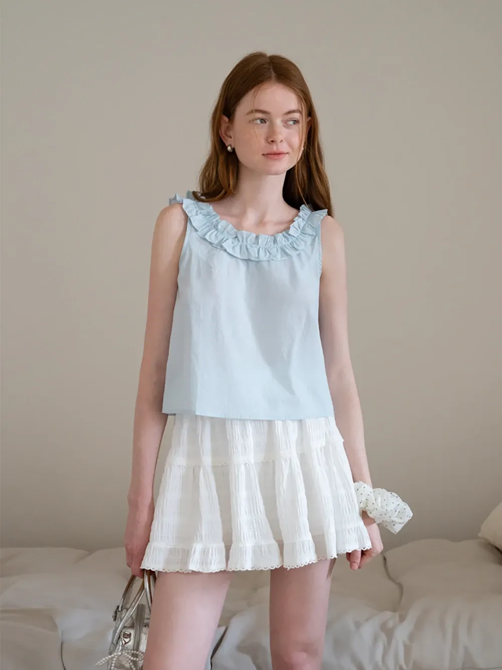 Women’s Sleeveless Top with Ruffle Neckline