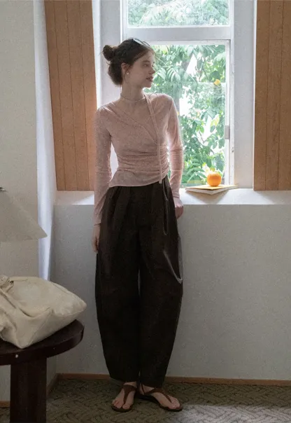 Asymmetrical rap-front draped knit top