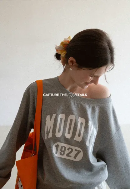 Gray Off Shoulder Sweatshirt with Bold Lettering and Year Print