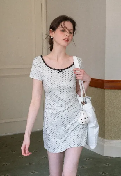 Polka dot dress with lace trim and matching cardigan