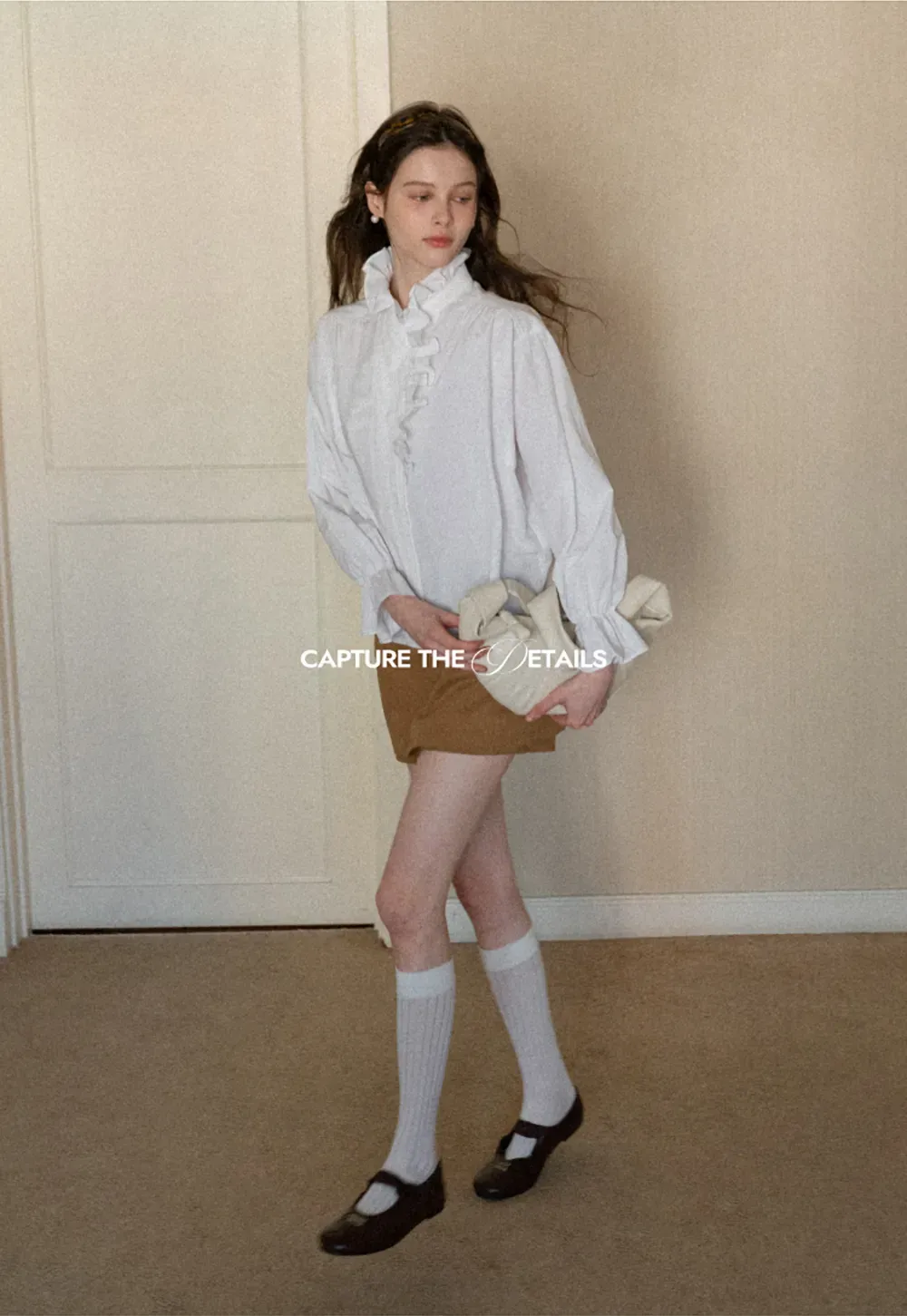 High waist pleated mini skirt with button front design