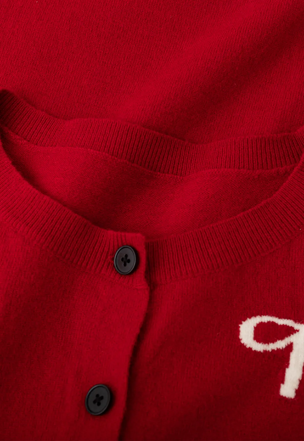 Woolen knit sweater with horse and bow motifs