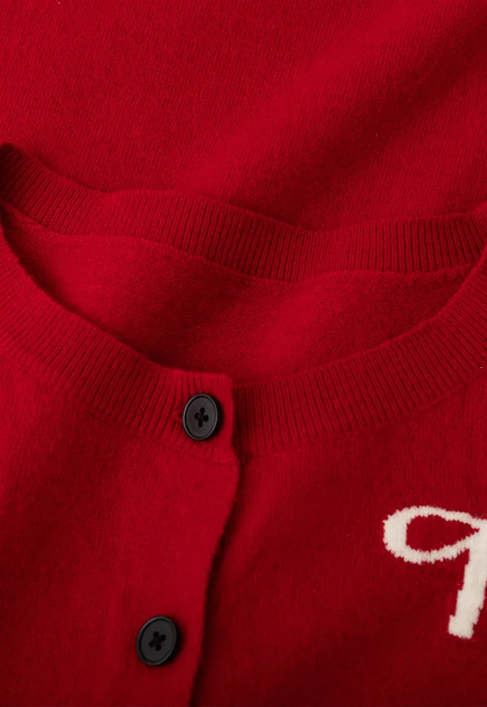 Woolen knit sweater with horse and bow motifs