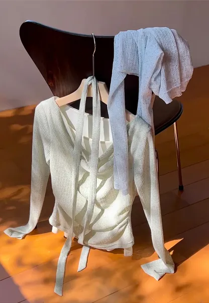 Long sleeve knit top with back tie detail