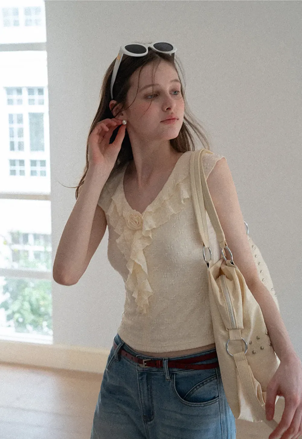 Sleeveless Top with Ruffled V Neck and Floral Detail