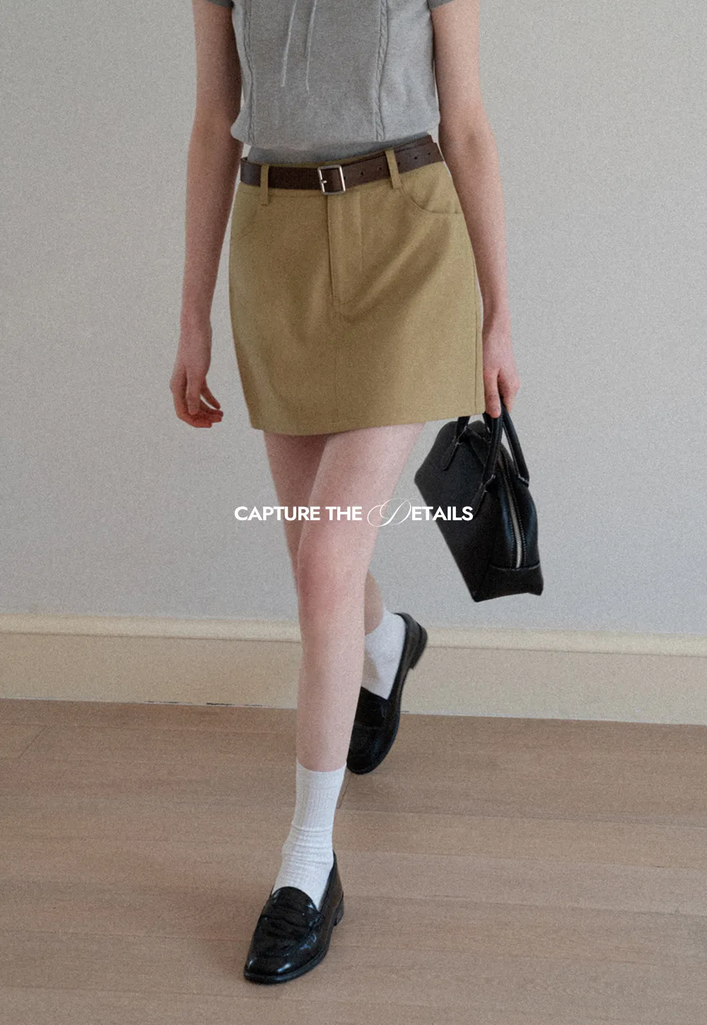A-line mini skirt with front pockets and belt loops