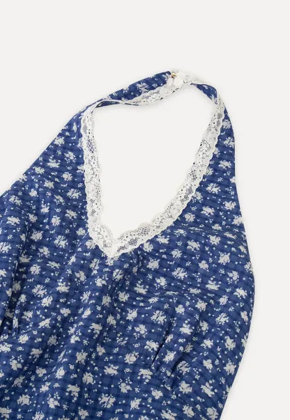 Halter neck dress with floral print and lace trim