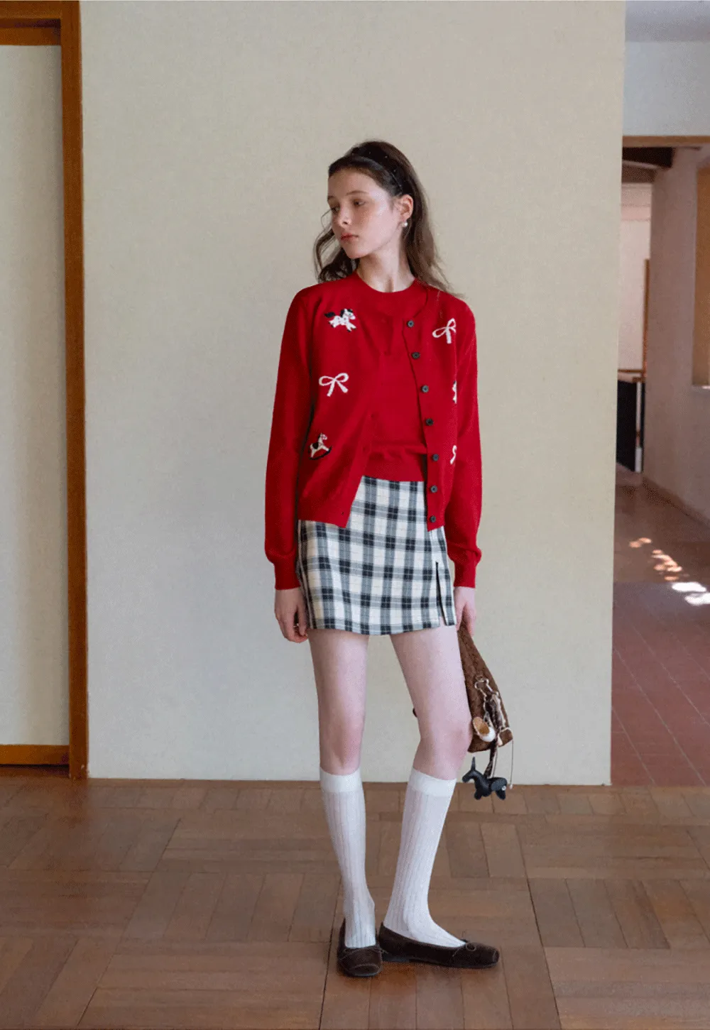 Woolen knit sweater with horse and bow motifs