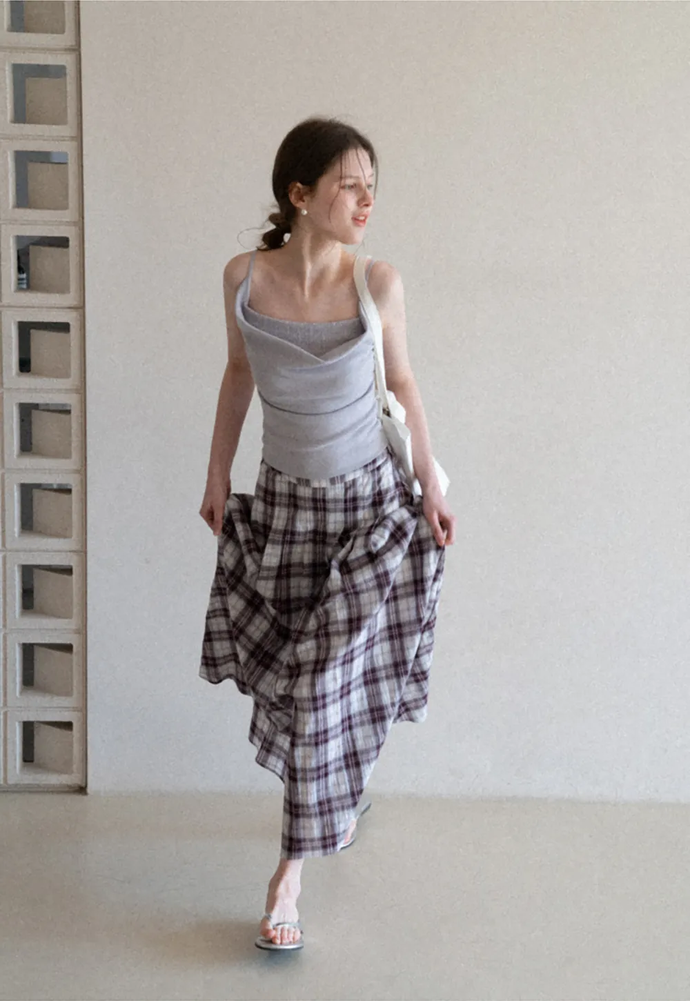 Silk-like tank top with thin straps and draped neckline