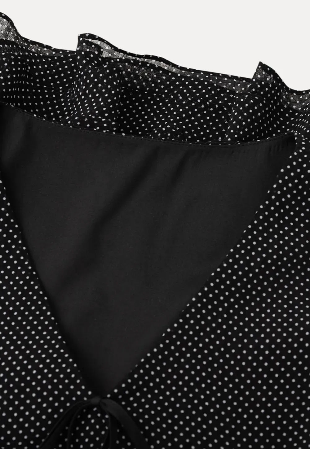 Polka Dot Sheer Blouse with Ruffled Hem and Tie Neck