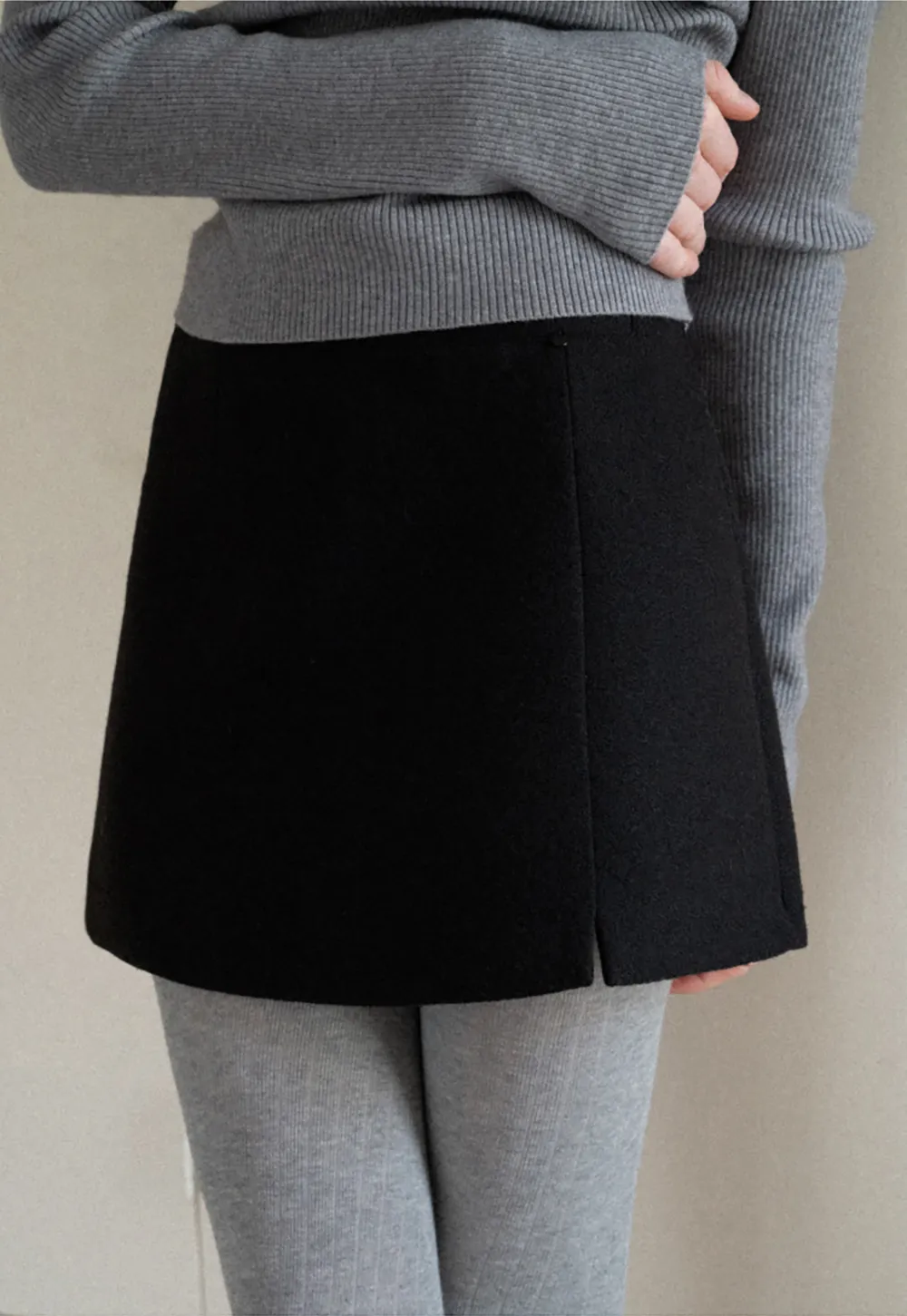 A-line mini skirt with textured fabric and central seam design