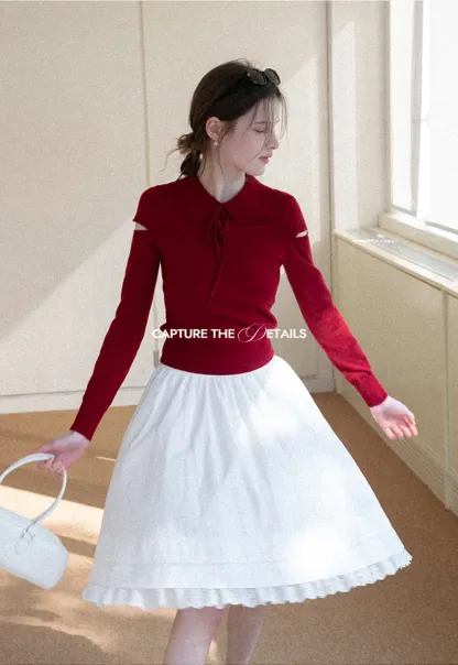 Elegant Knit Sweater with Bow Detail and Cutout Sleeves