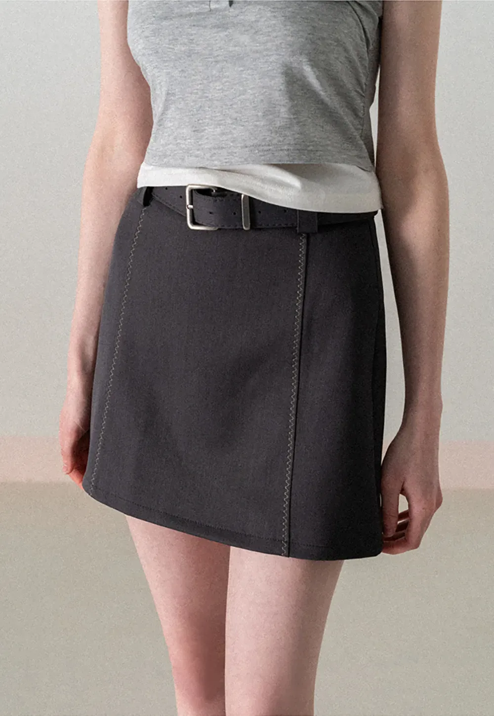 A-line mini skirt with contrast stitching and belt