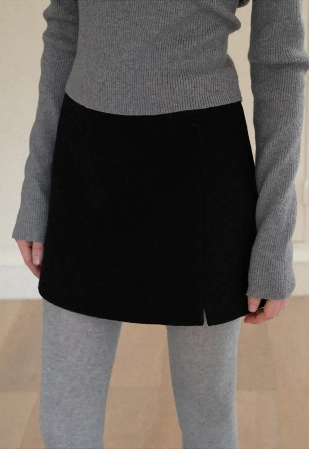 A-line mini skirt with textured fabric and central seam design