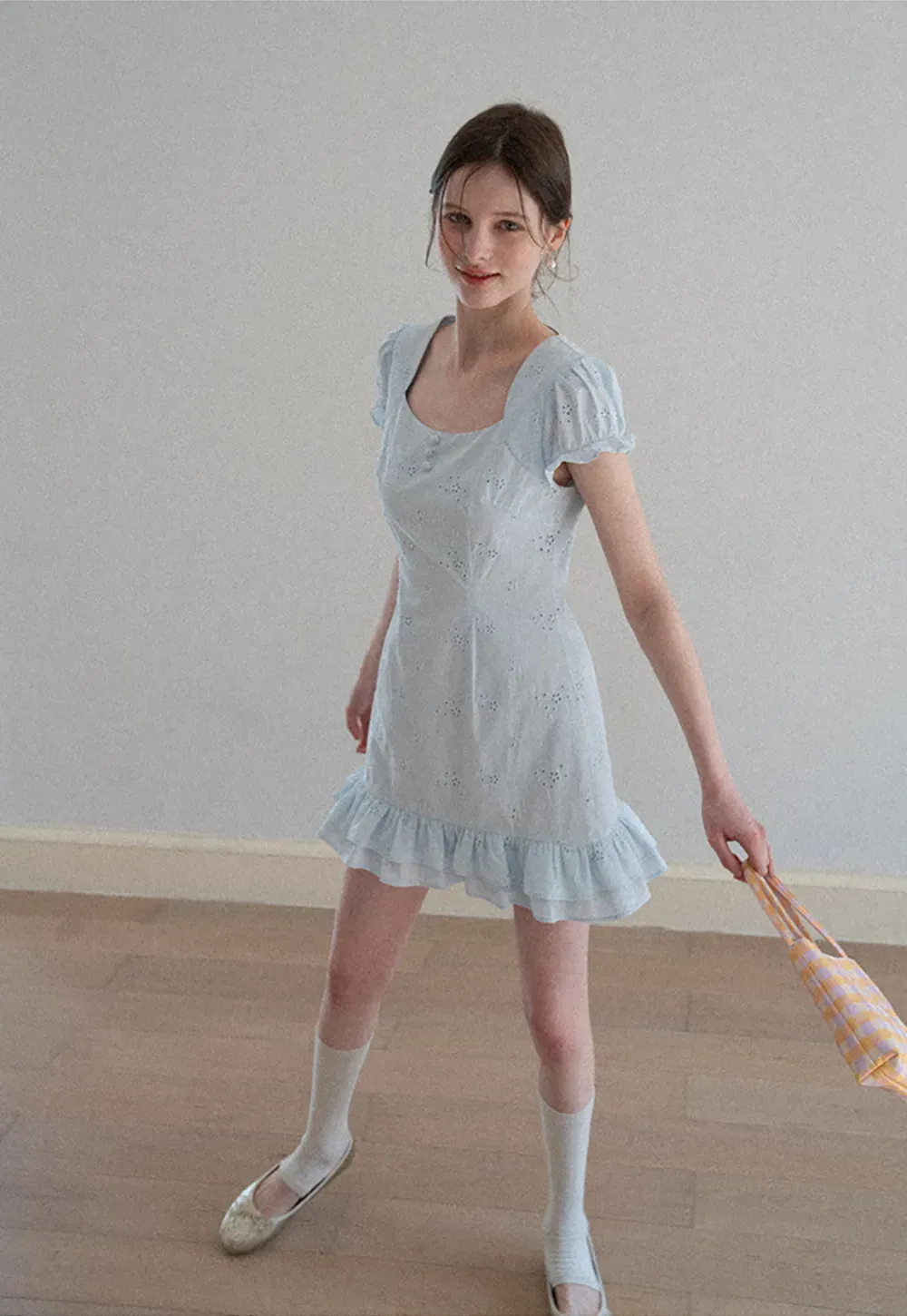 Eyelet dress with puff sleeves and ruffled hem