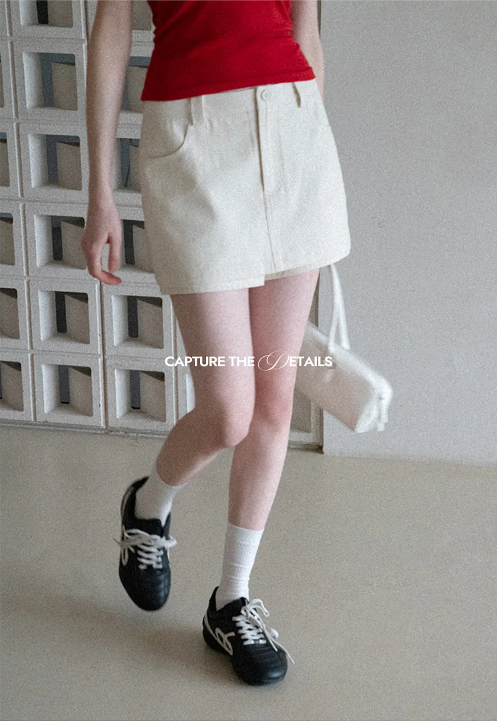 High waist pleated mini skirt with button front design