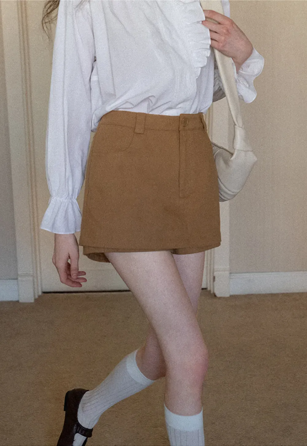 High waist pleated mini skirt with button front design