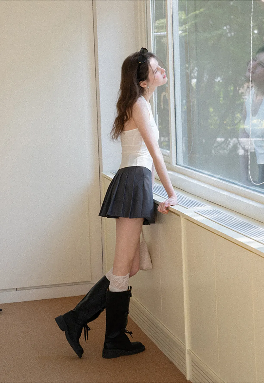 Pleated skirt with high waist and flared hem