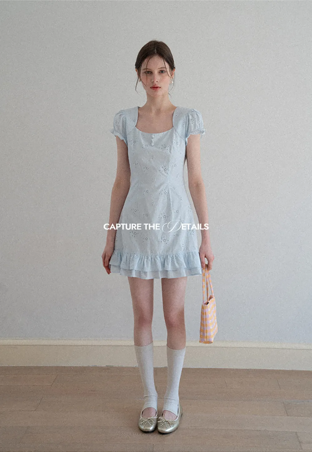 Eyelet dress with puff sleeves and ruffled hem