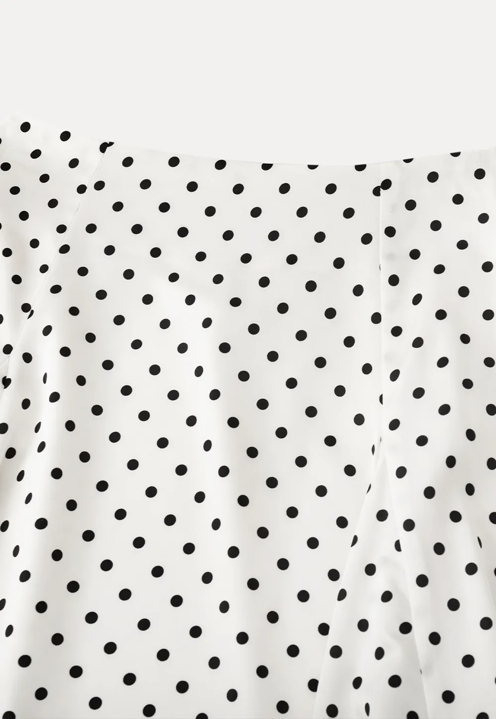 Polka dot asymmetrical hem skirt with pleats