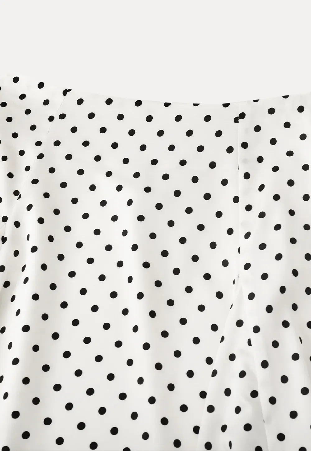 Polka dot asymmetrical hem skirt with pleats