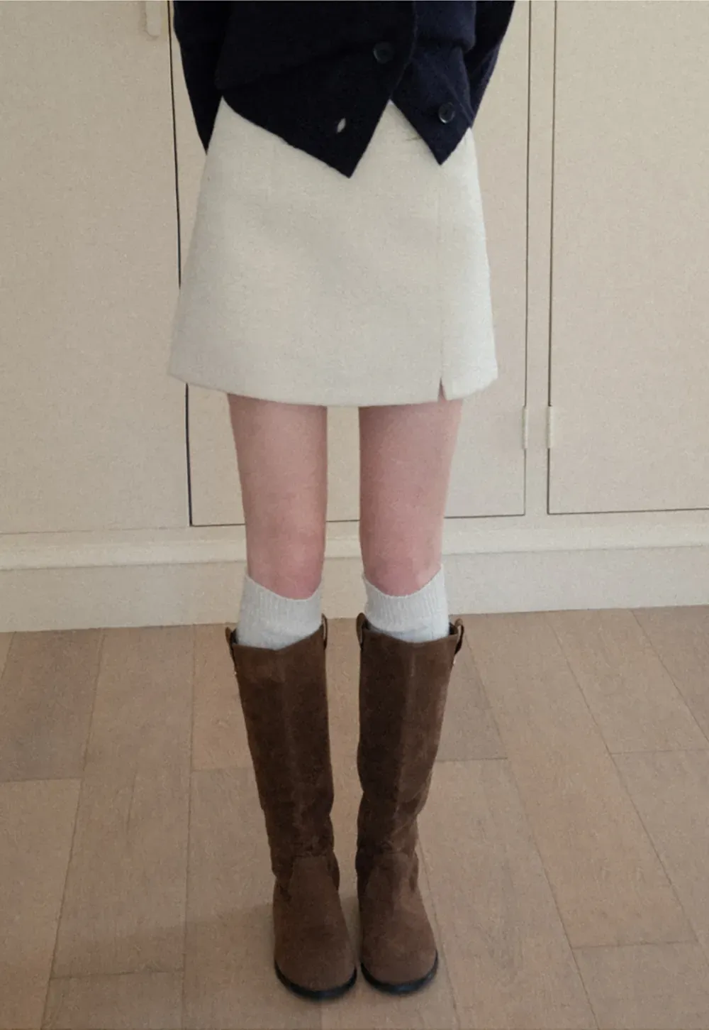 A-line mini skirt with textured fabric and central seam design