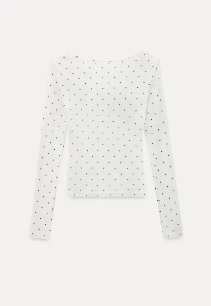 Polka dot long sleeve top with ruffled neckline