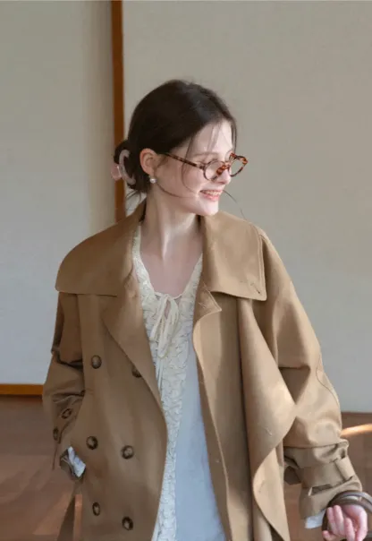 Long sleeve shirt with ruffled neckline and gathered cuffs