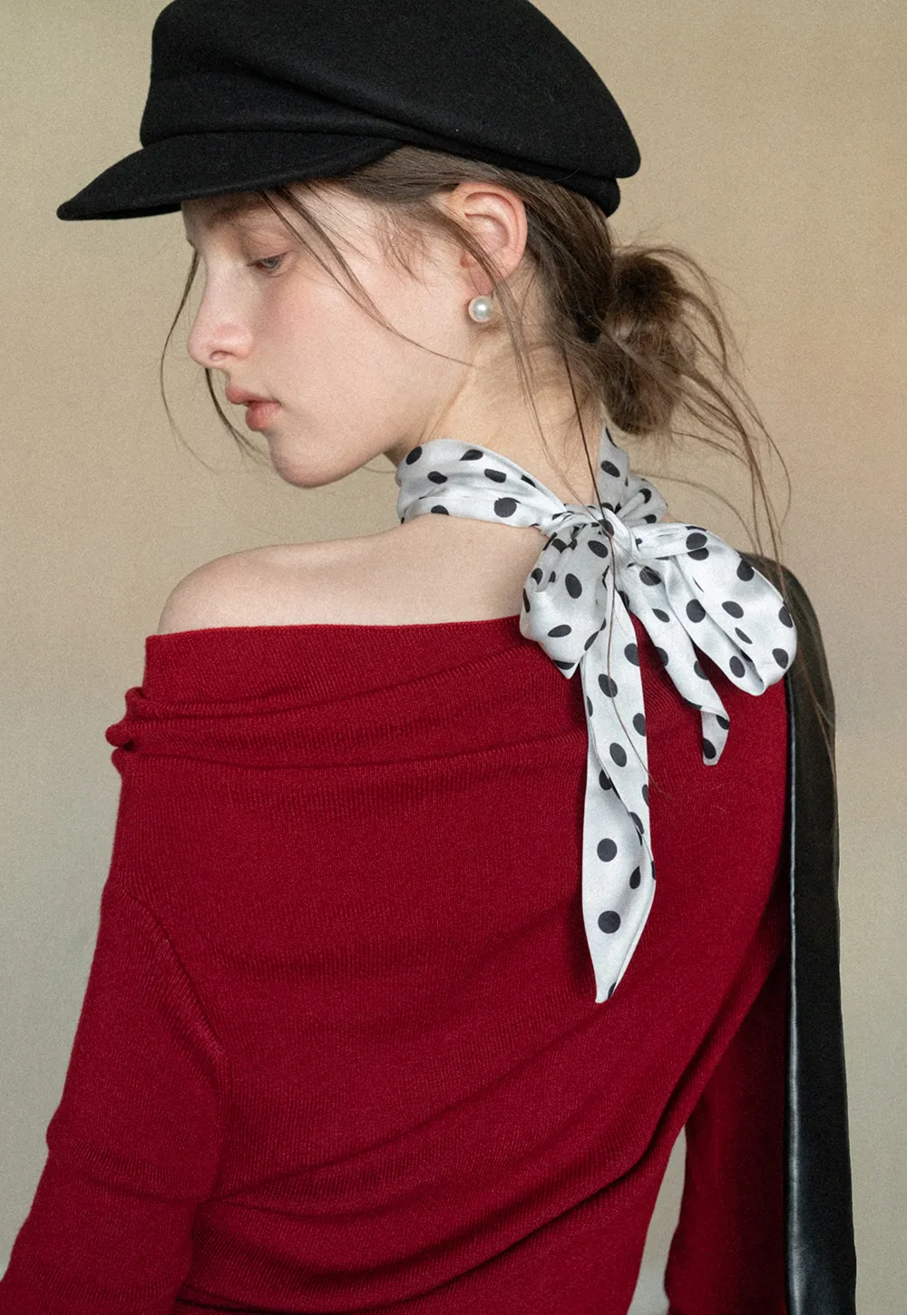 Elegant polka dot neck tie with bow design for women's fashion.