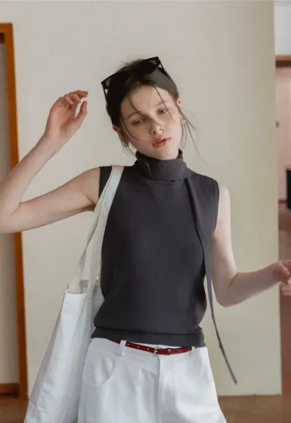 Sleeveless high neck knit top with side tie detail