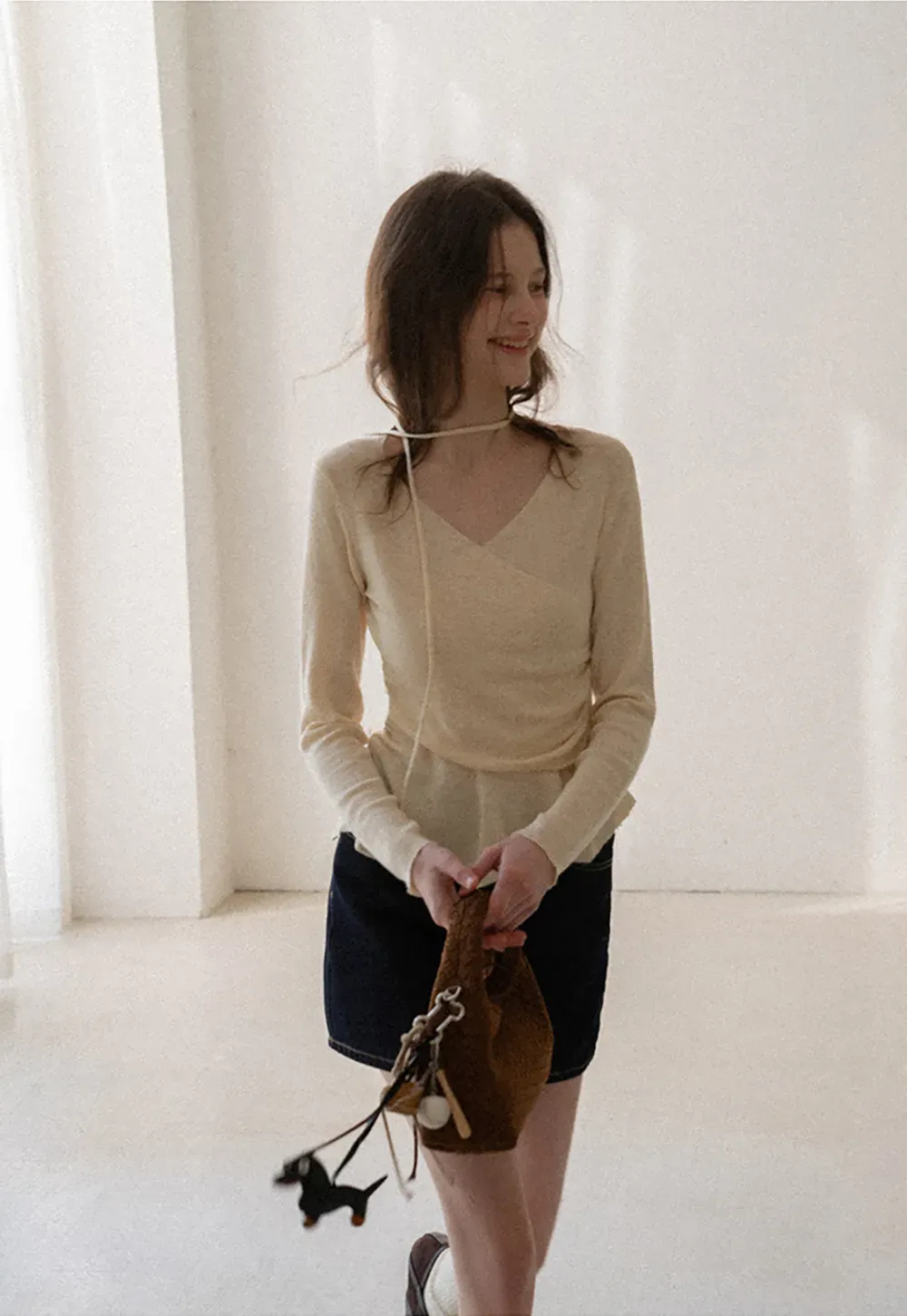 Long sleeve wrap knit sweater with ruched detail