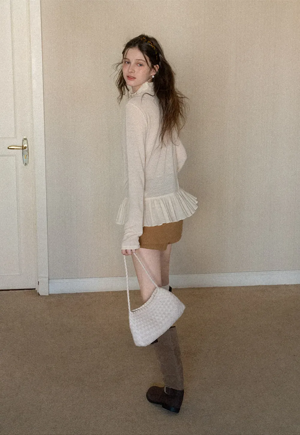 High waist pleated mini skirt with button front design