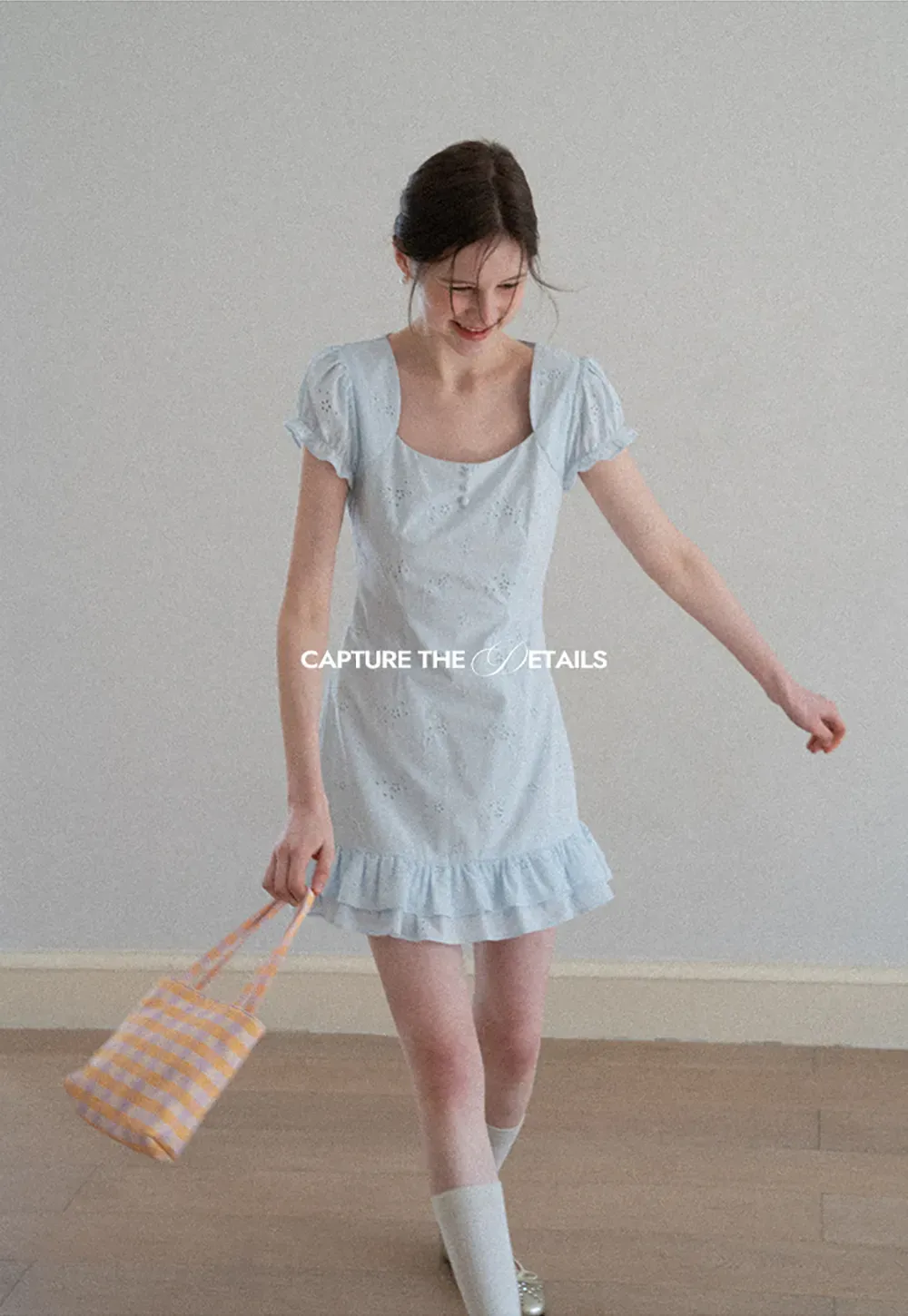 Eyelet dress with puff sleeves and ruffled hem