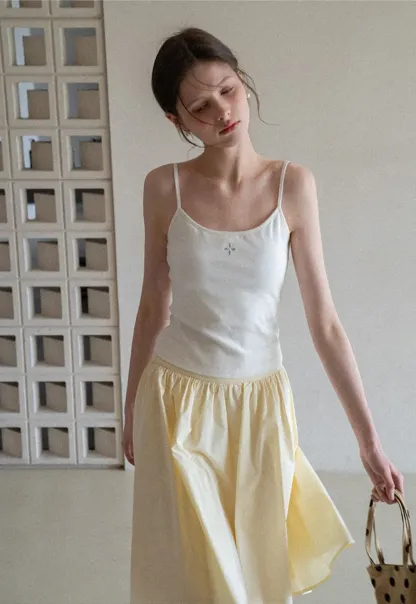 Gray tank top with small embroidered cross detail