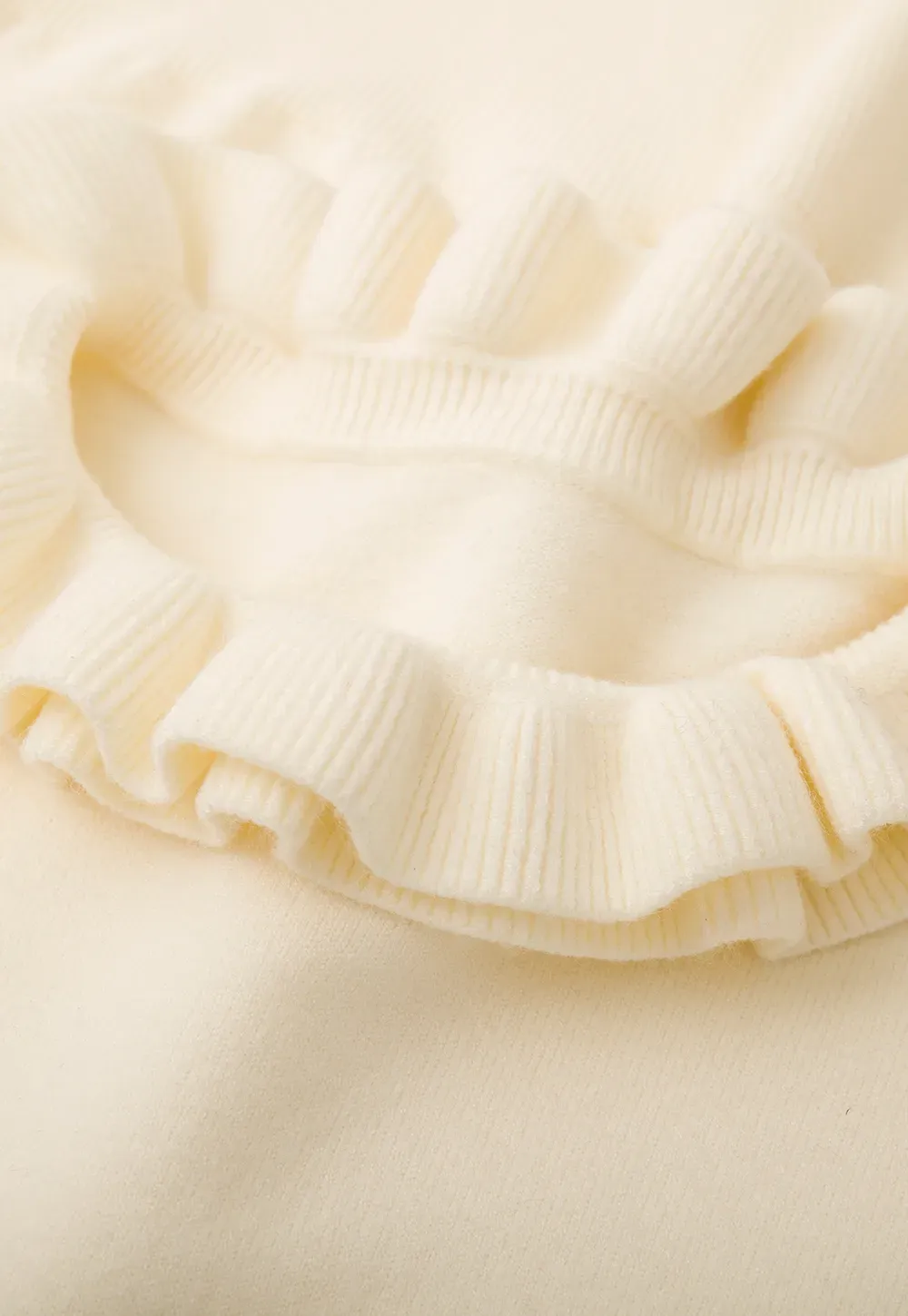 Elegant Ruffle Detail Knit Sweater with Flared Cuffs and Neckline