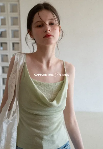 Silk-like tank top with thin straps and draped neckline