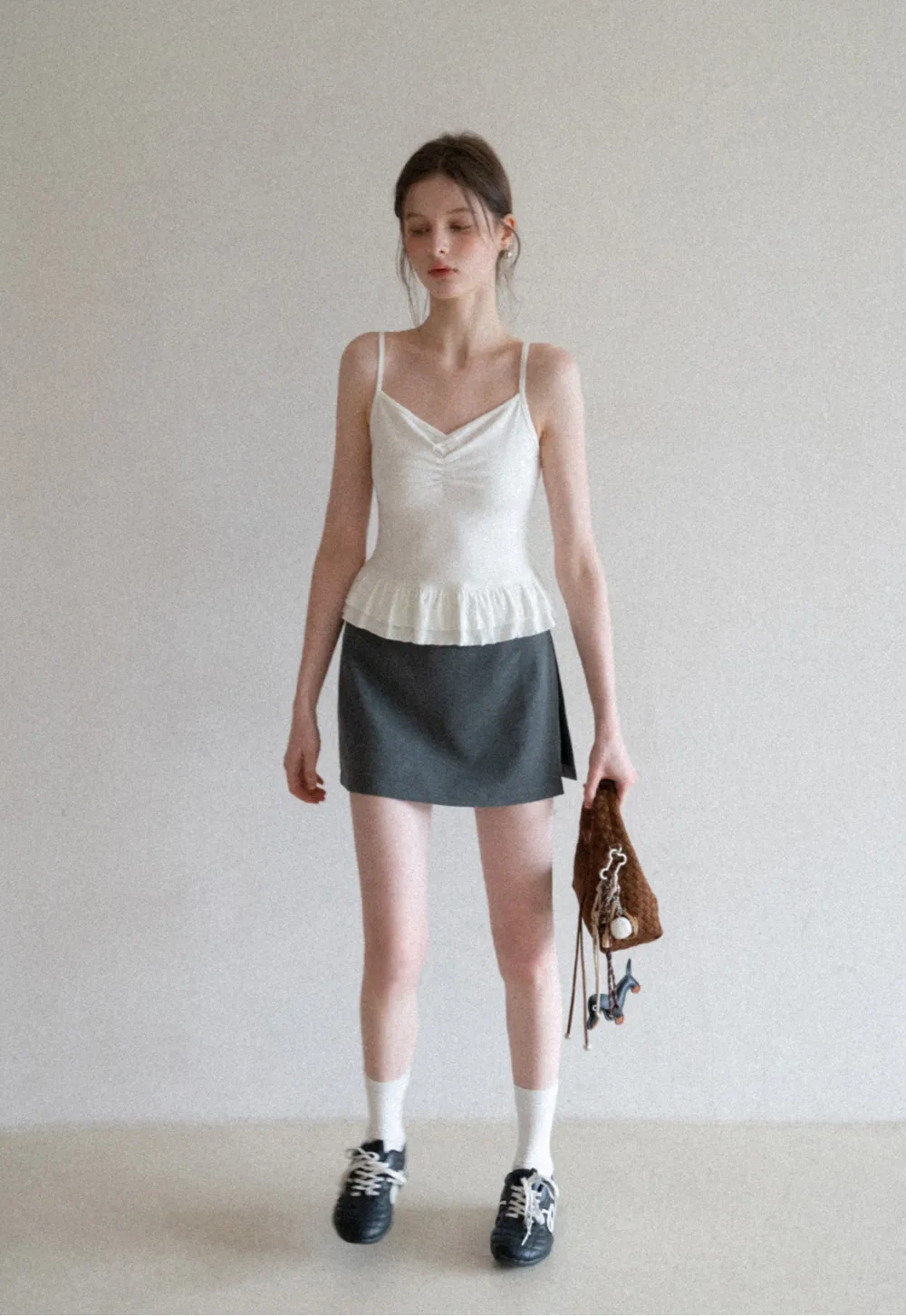 Elegant Pleated Mini Skirt with Asymmetrical Hem