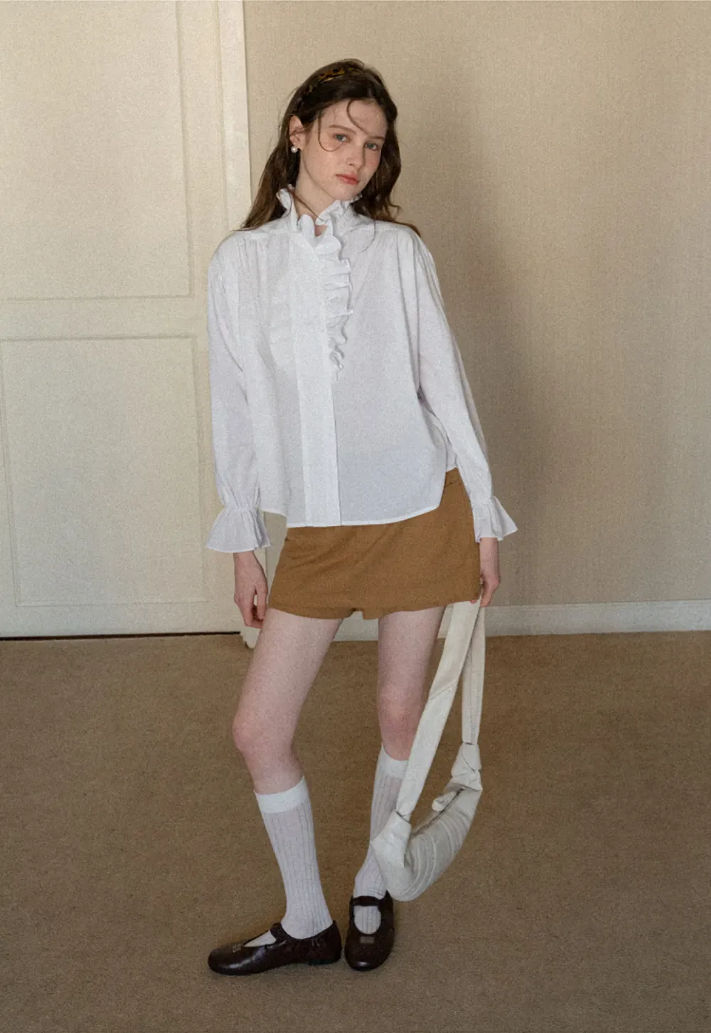 High waist pleated mini skirt with button front design