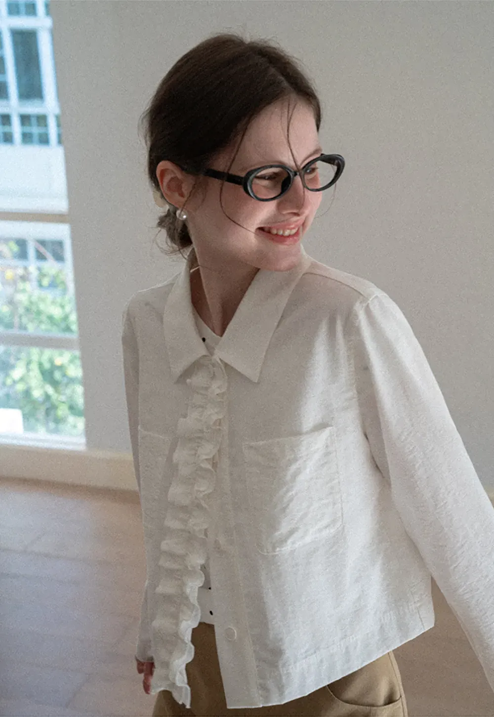 Short jacket with ruffled front placket and collar